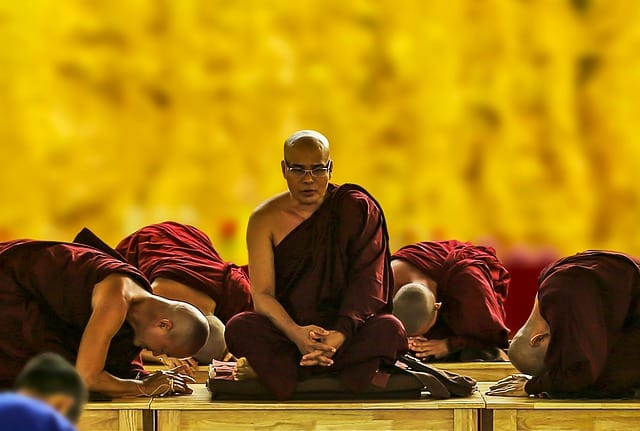 Men bowing down (Pexels)